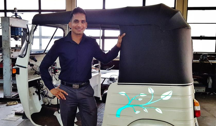 Photo courtesy of Sasiranga De Silva. De Silva with his invention. Electric Tuk-tuk